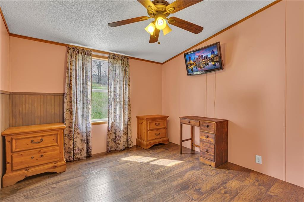 204 Hollowvue Road Wampum, PA 16157 - Photo 19 of 39 wooden floor in an empty room with a window