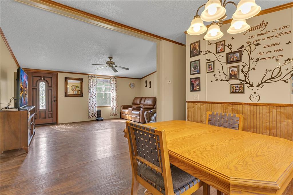 204 Hollowvue Road Wampum, PA 16157 - Photo 21 of 39 a bedroom with a bed and dresser with wooden floor
