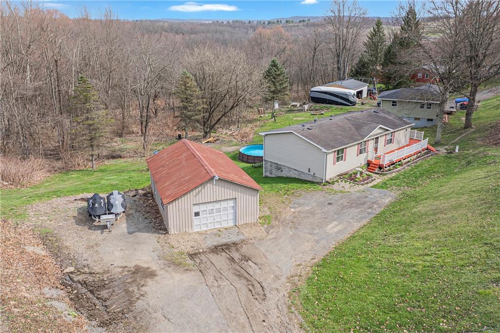 204 Hollowvue Road Wampum, PA 16157 - Photo 29 of 39 a view of a house with a yard and sitting area