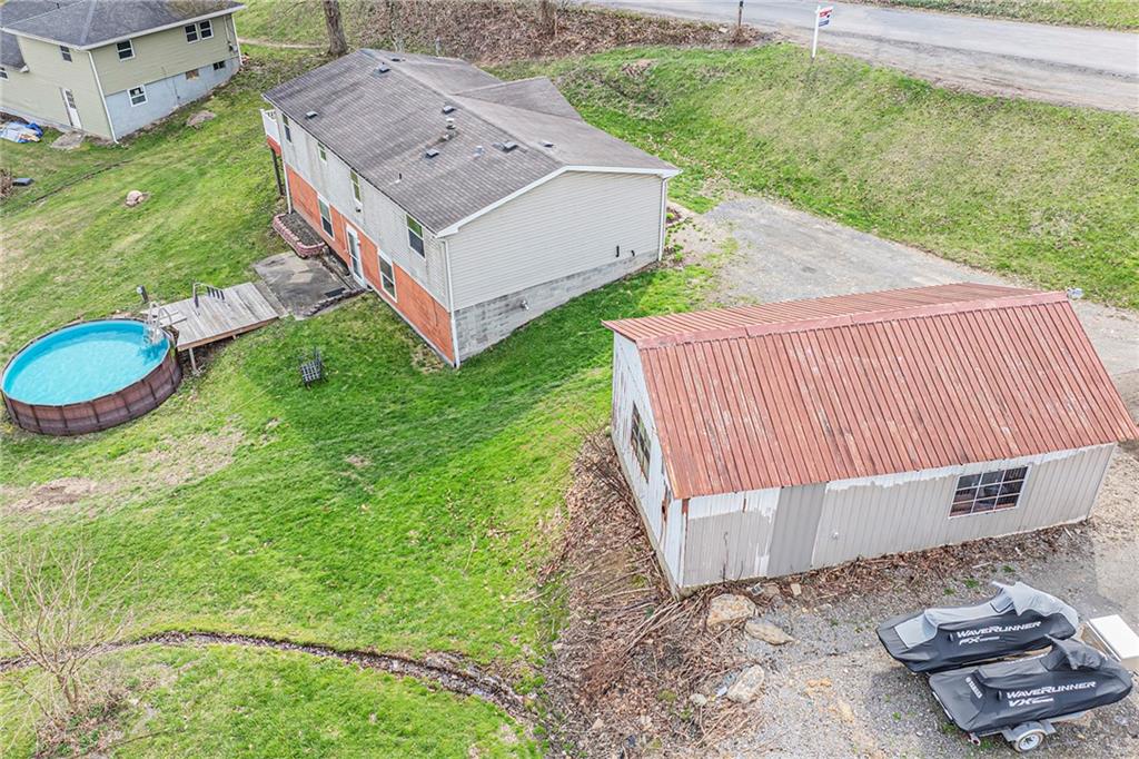 204 Hollowvue Road Wampum, PA 16157 - Photo 31 of 39 a aerial view of a house with backyard