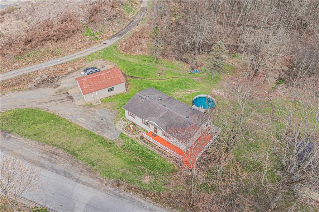 204 Hollowvue Road Wampum, PA 16157 - Photo 35 of 39 an aerial view of a house with a backyard