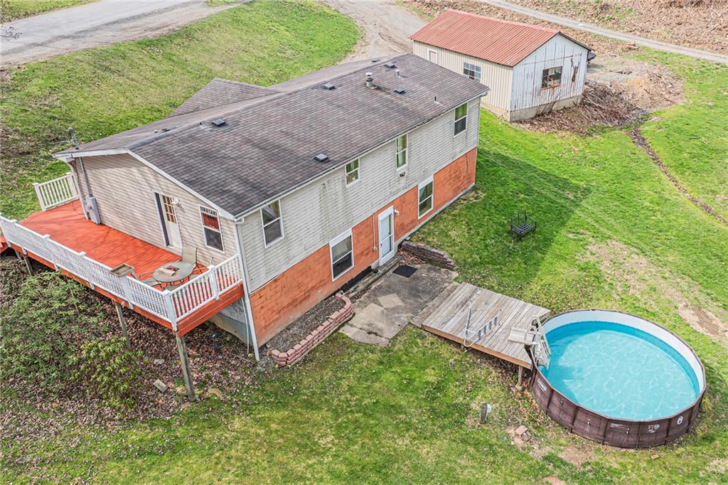 204 Hollowvue Road Wampum, PA 16157 - Photo 37 of 39 an aerial view of a house with backyard space and balcony