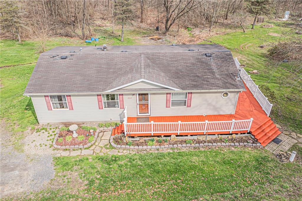 204 Hollowvue Road Wampum, PA 16157 - Photo 39 of 39 a backyard of a house with table and chairs