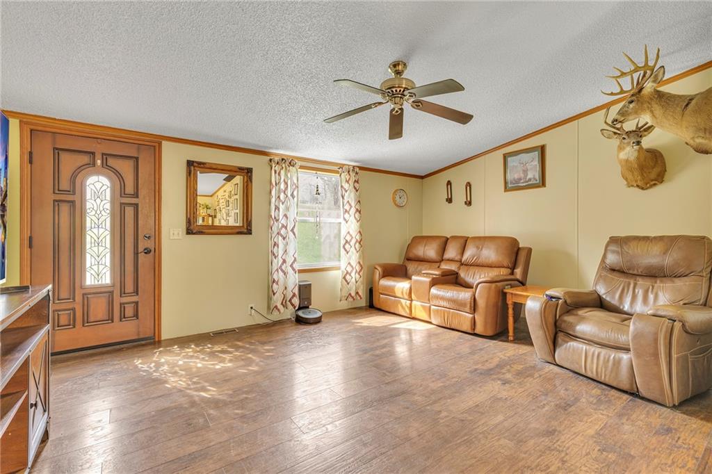 204 Hollowvue Road Wampum, PA 16157 - Photo 7 of 39 a living room with furniture and a window