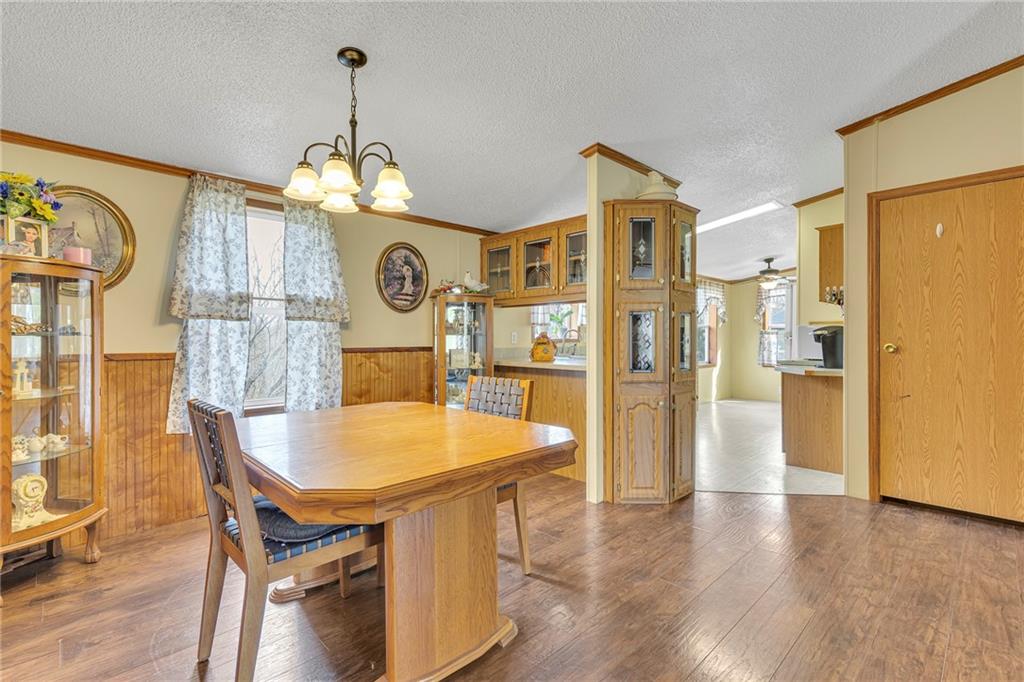 204 Hollowvue Road Wampum, PA 16157 - Photo 8 of 39 a view of a dining room with furniture and wooden floor