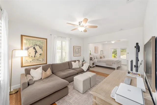 an aerial view of residential houses with outdoor space and trees