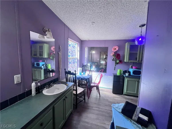 a view of a dining room with furniture and chandelier