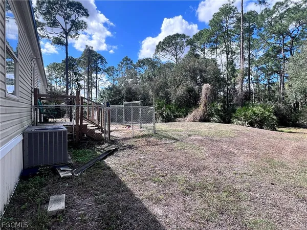 a view of backyard with green space