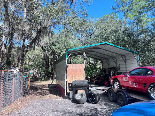 a view of a car park in front of a house