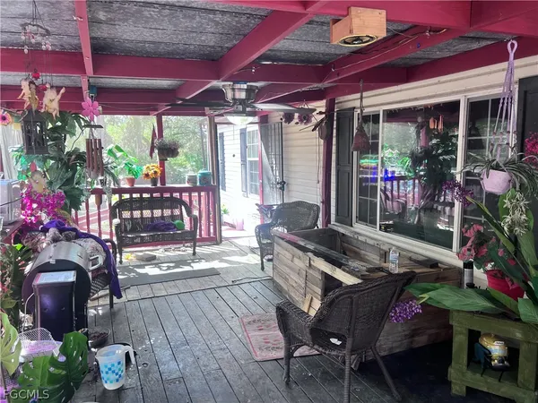 a view of a chairs and table in the patio