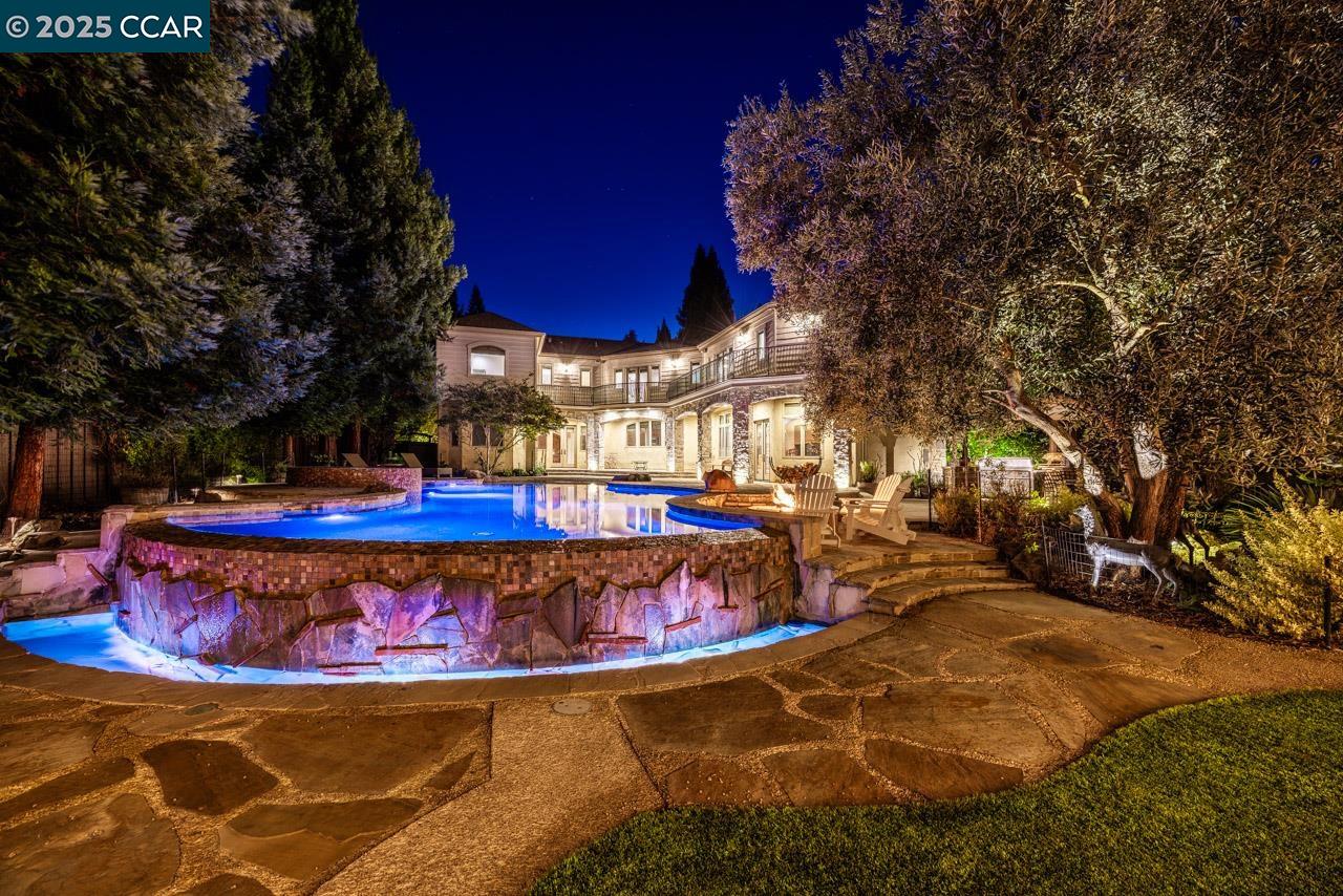a view of a swimming pool with a patio