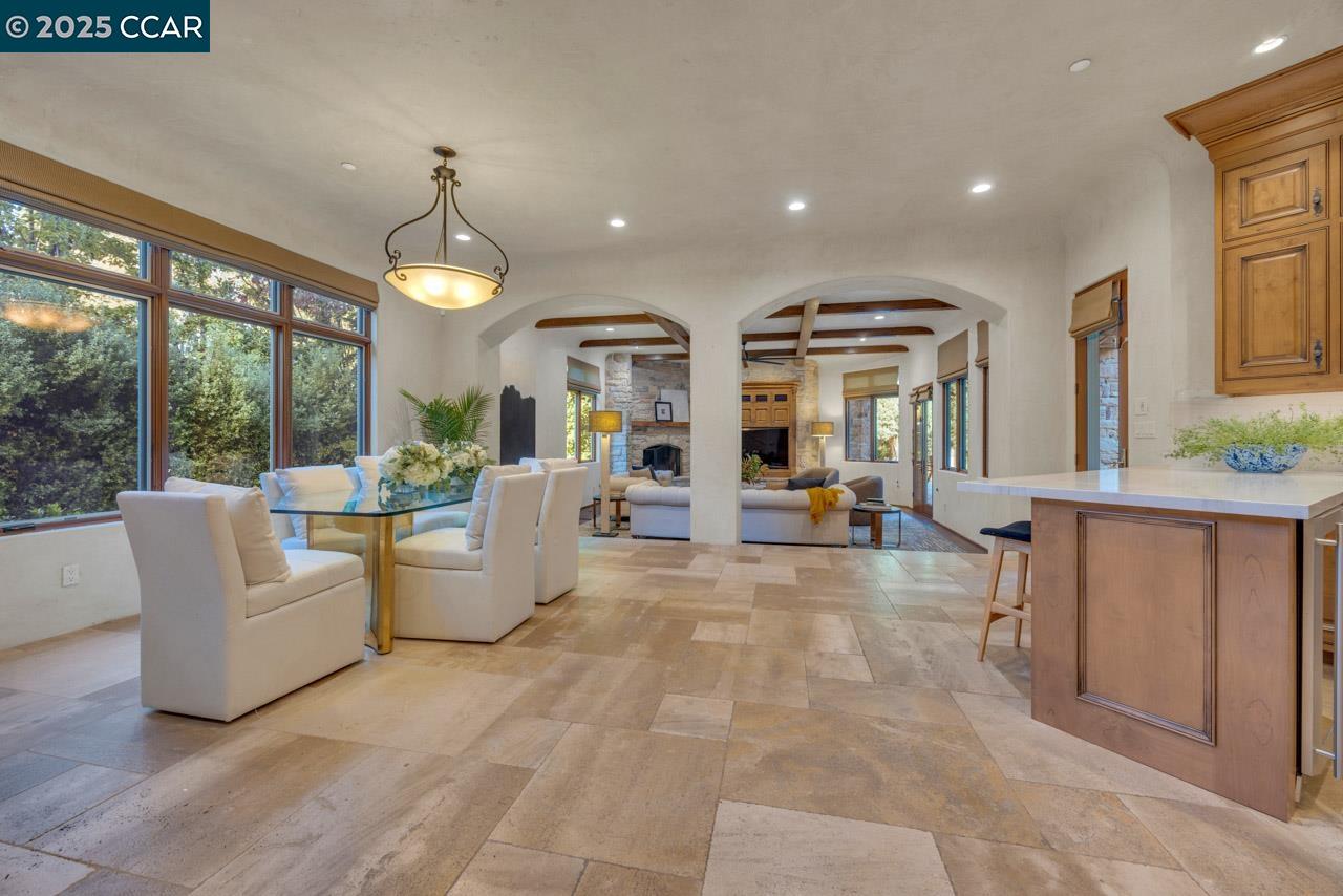 104 Muir Lane Alamo, CA 94507 - Photo 14 of 54 a view of a living room and kitchen with furniture and a large window
