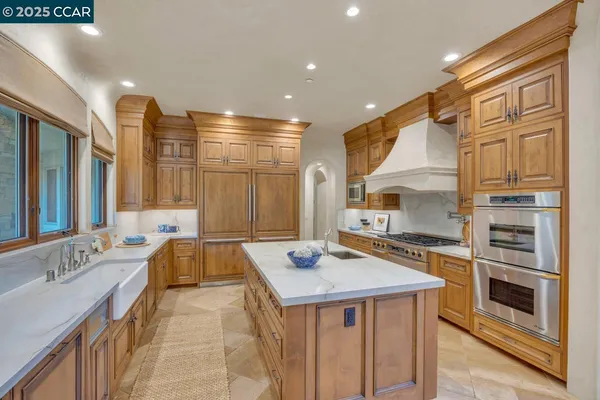 a view of a kitchen with a sink and microwave