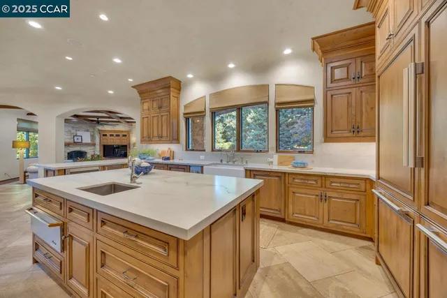 a kitchen with a sink stove and cabinets