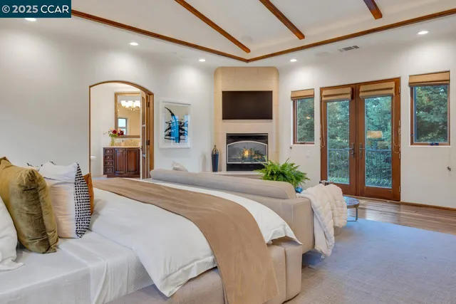a spacious bathroom with a granite countertop sink a toilet and shower