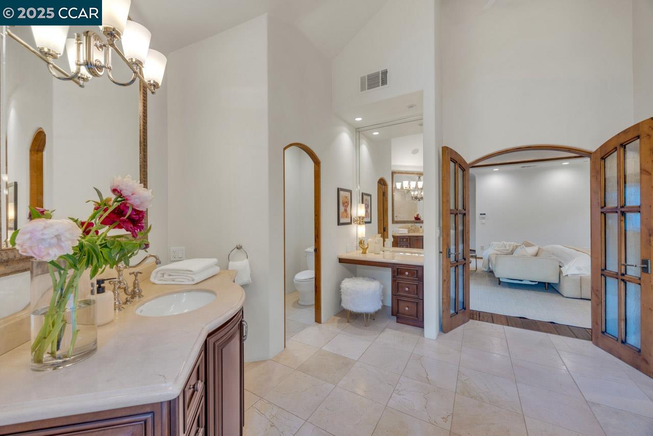 104 Muir Lane Alamo, CA 94507 - Photo 27 of 54 a spacious bathroom with a granite countertop sink a toilet and shower