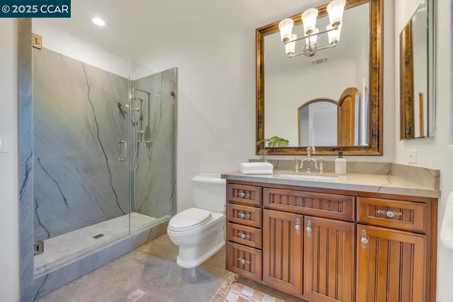 a view of a bathroom with a bathtub and shower