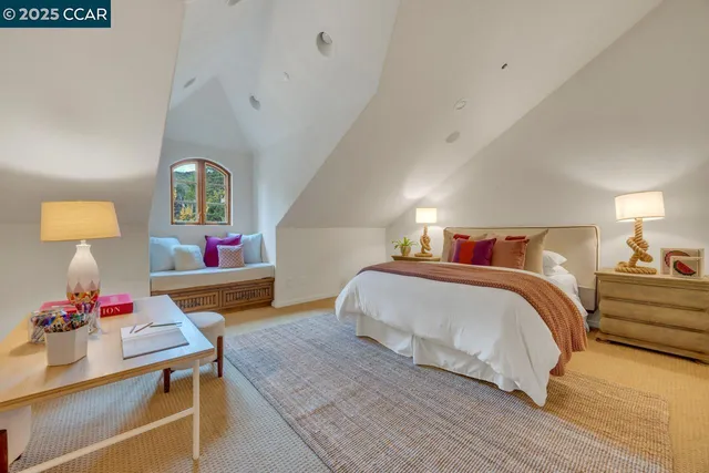 a bedroom with a bed and a lamp