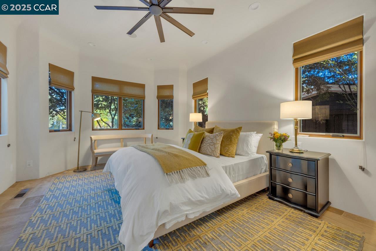 104 Muir Lane Alamo, CA 94507 - Photo 33 of 54 a bedroom with a bed a dresser next to a window