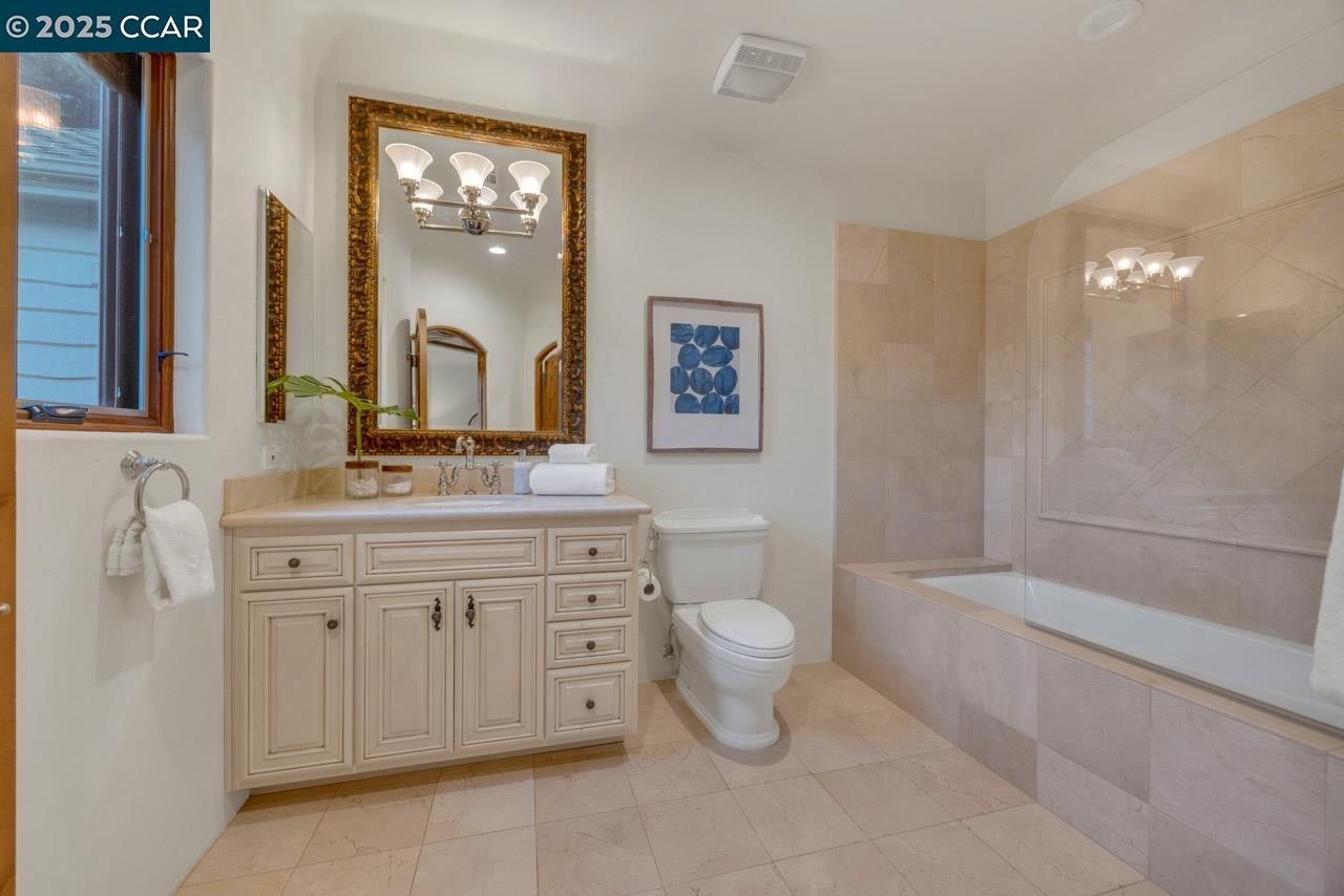 104 Muir Lane Alamo, CA 94507 - Photo 35 of 54 a bathroom with a double vanity sink a toilet and a mirror