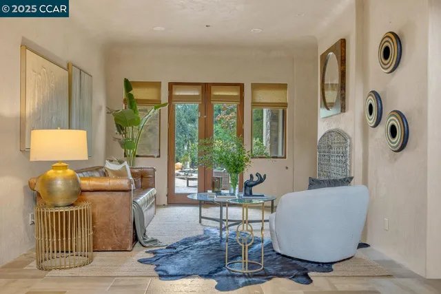 a room with pool table and windows