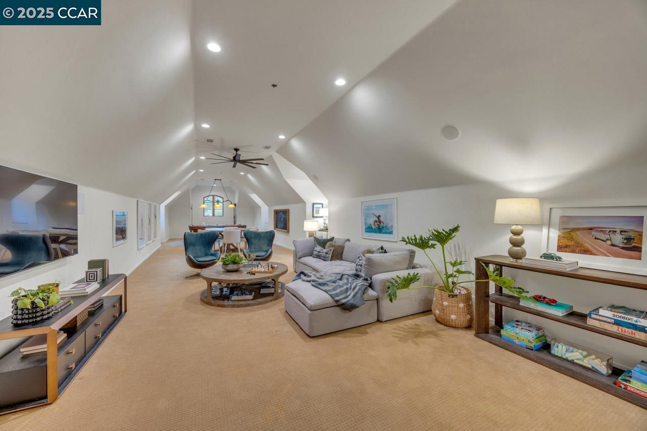 104 Muir Lane Alamo, CA 94507 - Photo 38 of 54 a living room with furniture and a flat screen tv