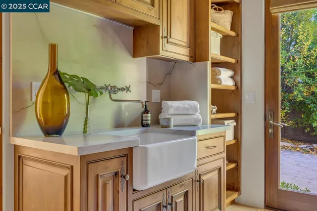 a view of a kitchen with window and stainless steel appliances