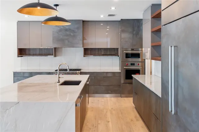 a view of a livingroom with wooden floor and window