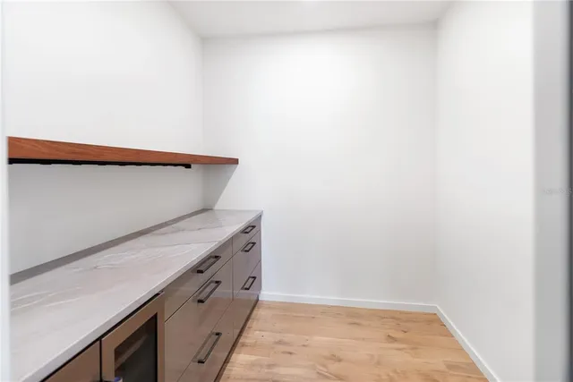 a view of a kitchen with sink washer and dryer