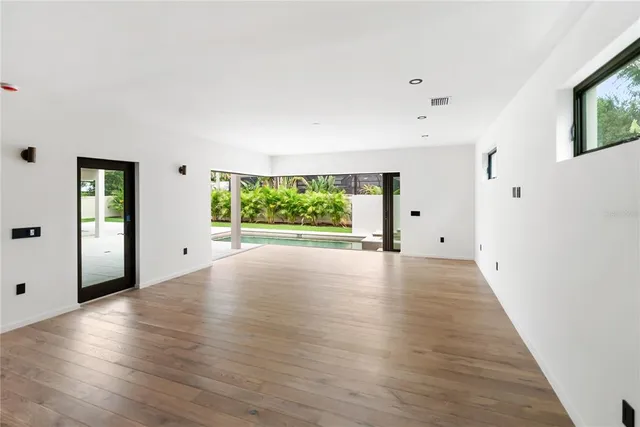 a view of an empty room with a large window