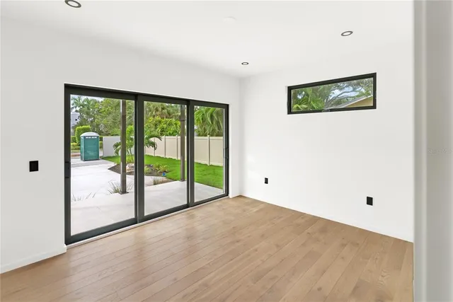 an aerial view of a houses with a yard