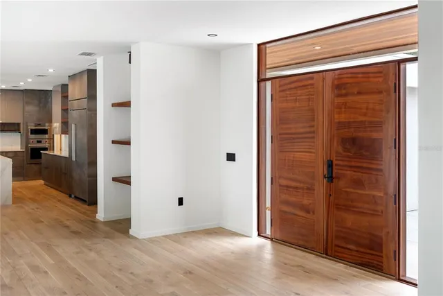 a kitchen with stainless steel appliances granite countertop a sink and a stove