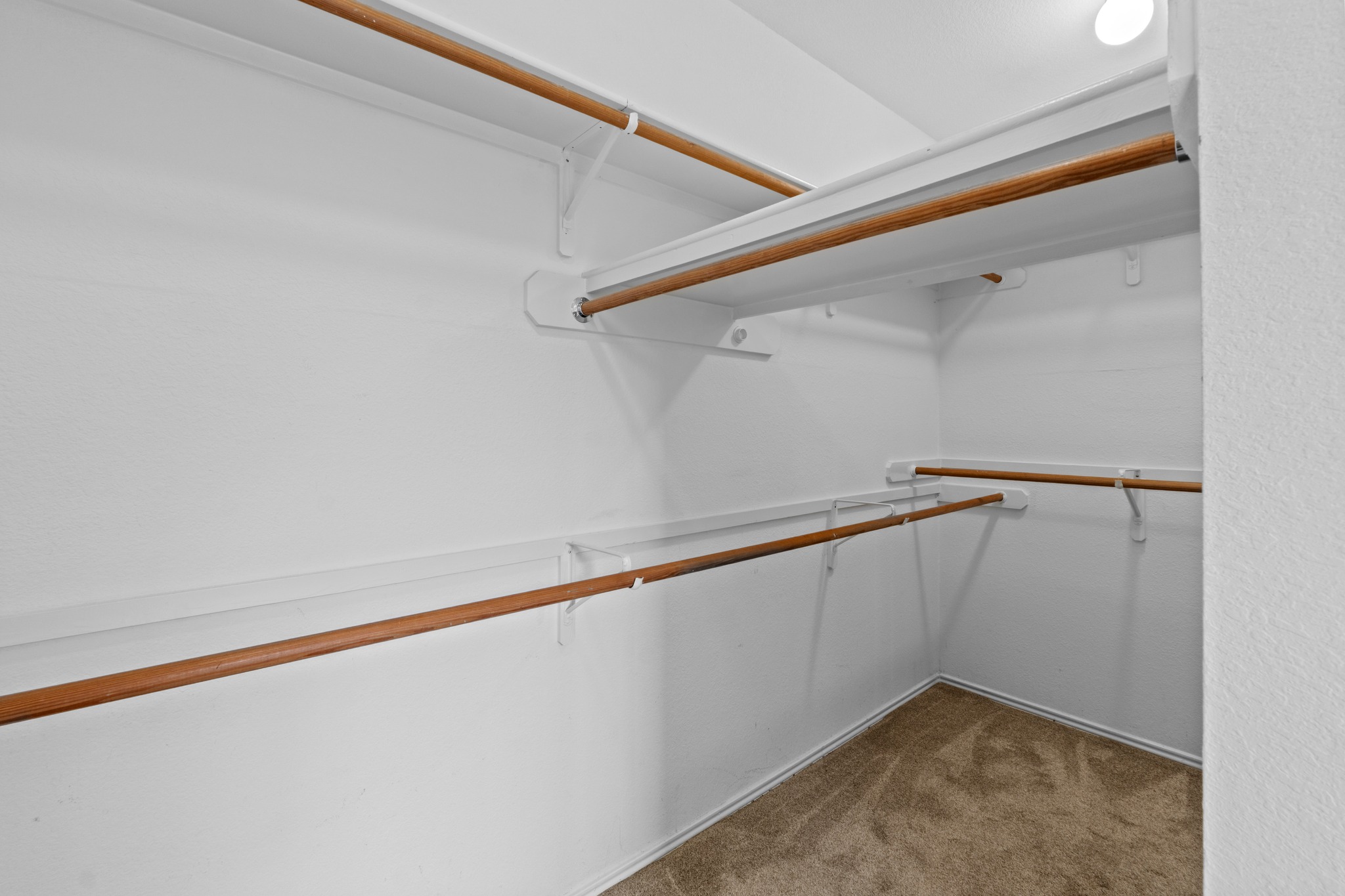 8605 Axis Drive Austin, TX 78749 - Photo 22 of 38 Ample closet space with practical shelving and hanging rods to organize your wardrobe.