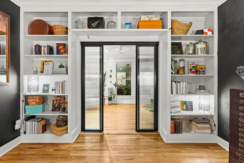 a shelf with books and knick knacks on it