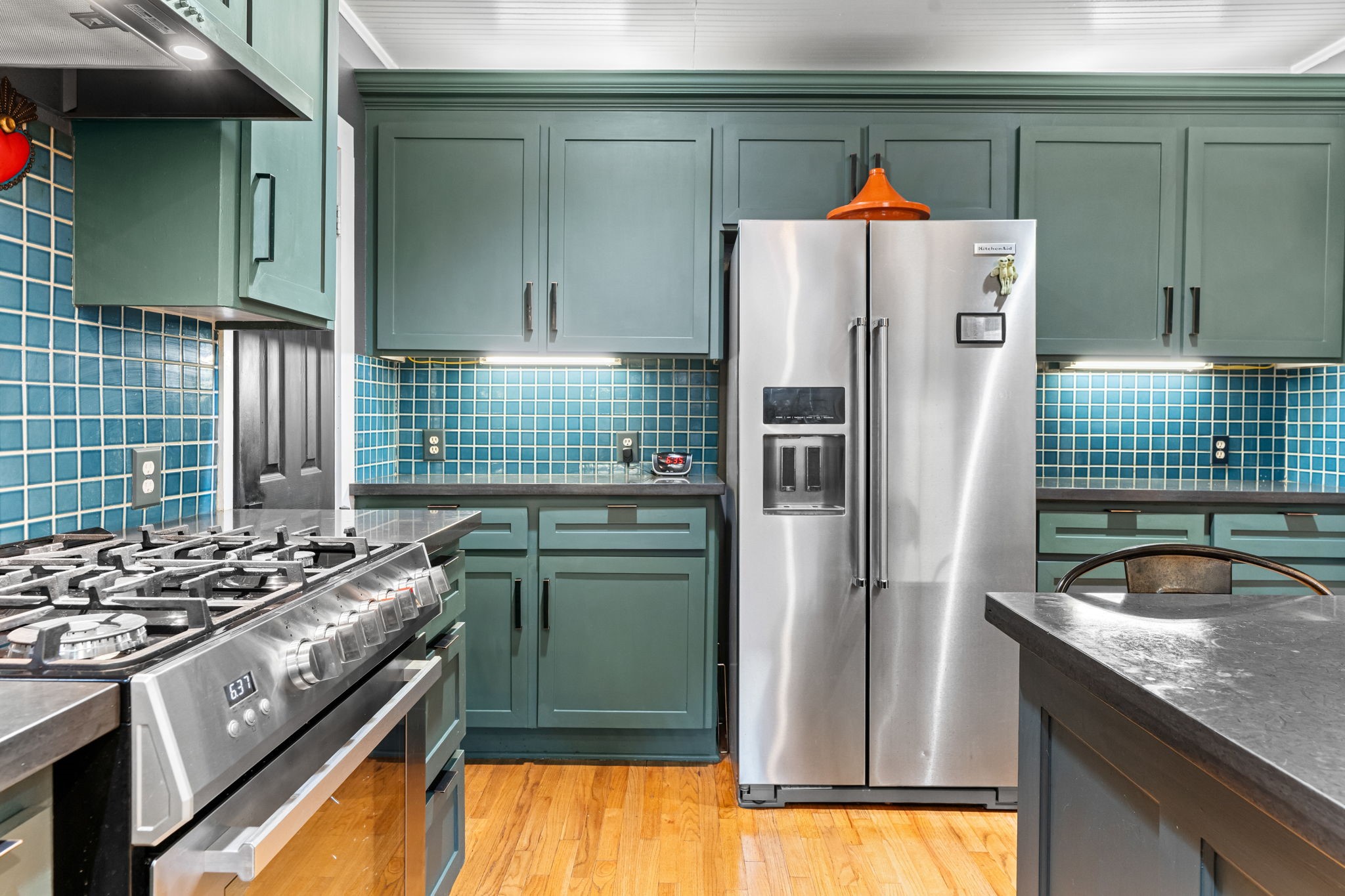 802 Ralfallen Street Houston, TX 77008 - Photo 19 of 45 a kitchen with a refrigerator and a sink