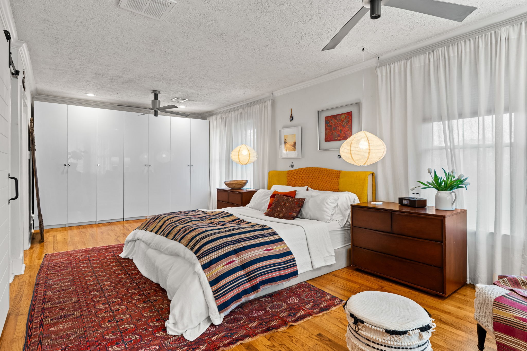 802 Ralfallen Street Houston, TX 77008 - Photo 22 of 45 a bedroom with a bed dresser and a window