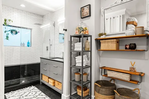 a bathroom with a sink and a mirror