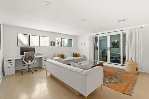 a living room with furniture and a window