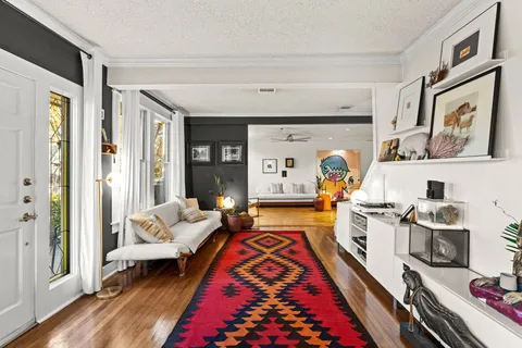 a very nice looking living room with furniture and a rug