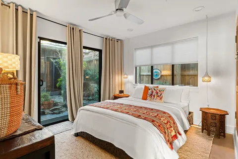 a bedroom with a bed and a window