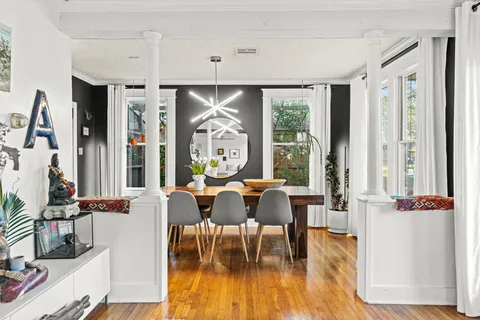 a view of a dining room with furniture window and outside view