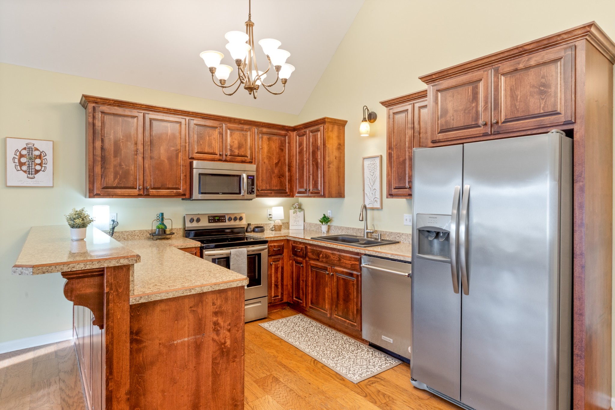 3001 Westcot Road White Bluff, TN 37187 - Photo 11 of 36 a kitchen with stainless steel appliances granite countertop a refrigerator a stove top oven a sink dishwasher and wooden cabinets