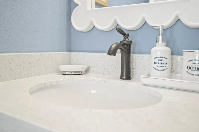 a front view of a house with yard and green space