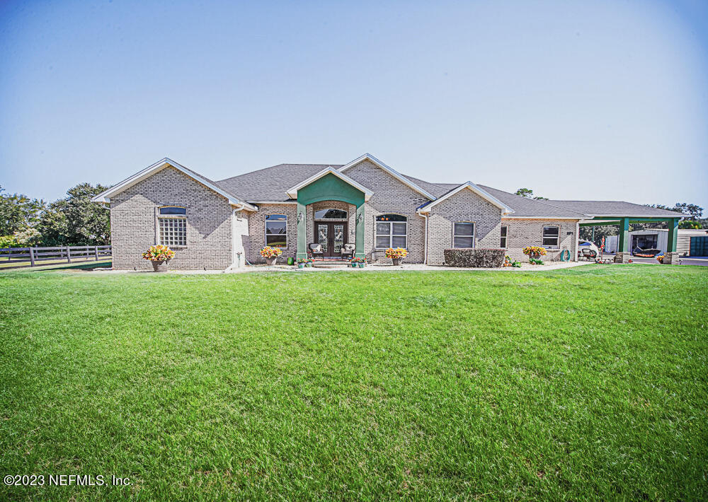 12625 Sawpit Road Jacksonville, FL 32226 - Photo 12 of 63 a front view of house with yard and green space