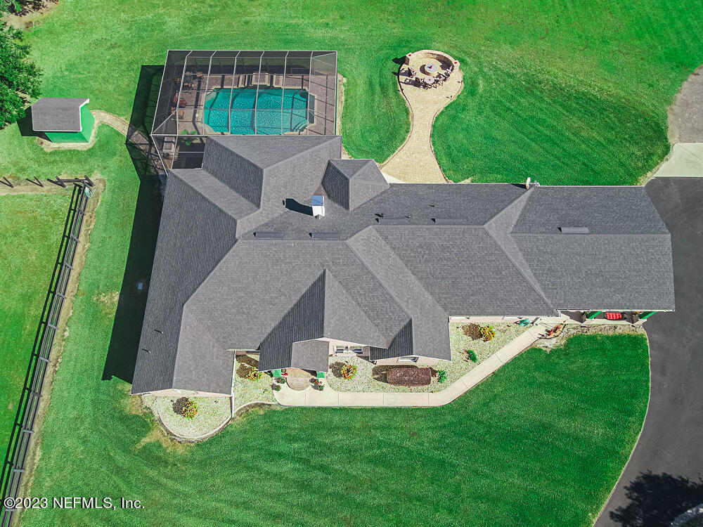 12625 Sawpit Road Jacksonville, FL 32226 - Photo 16 of 63 an aerial view of a house with backyard swimming pool and outdoor seating