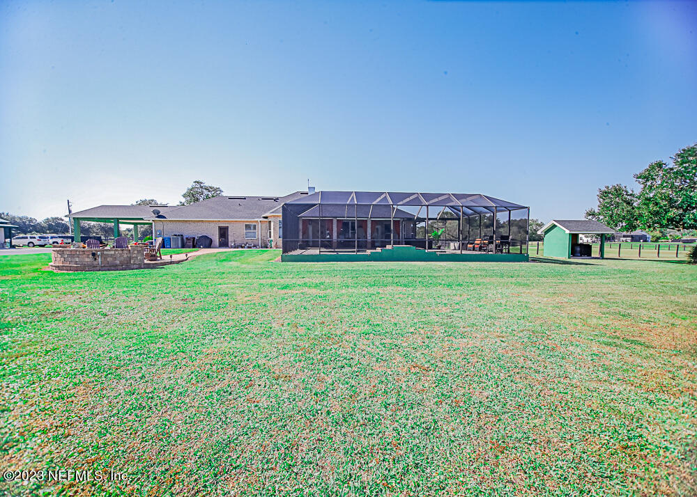 12625 Sawpit Road Jacksonville, FL 32226 - Photo 22 of 63 a view of a house with a yard and sitting area