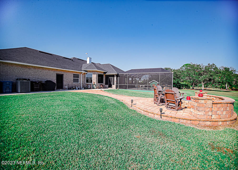 12625 Sawpit Road Jacksonville, FL 32226 - Photo 25 of 63 a view of a house with a yard porch and sitting area