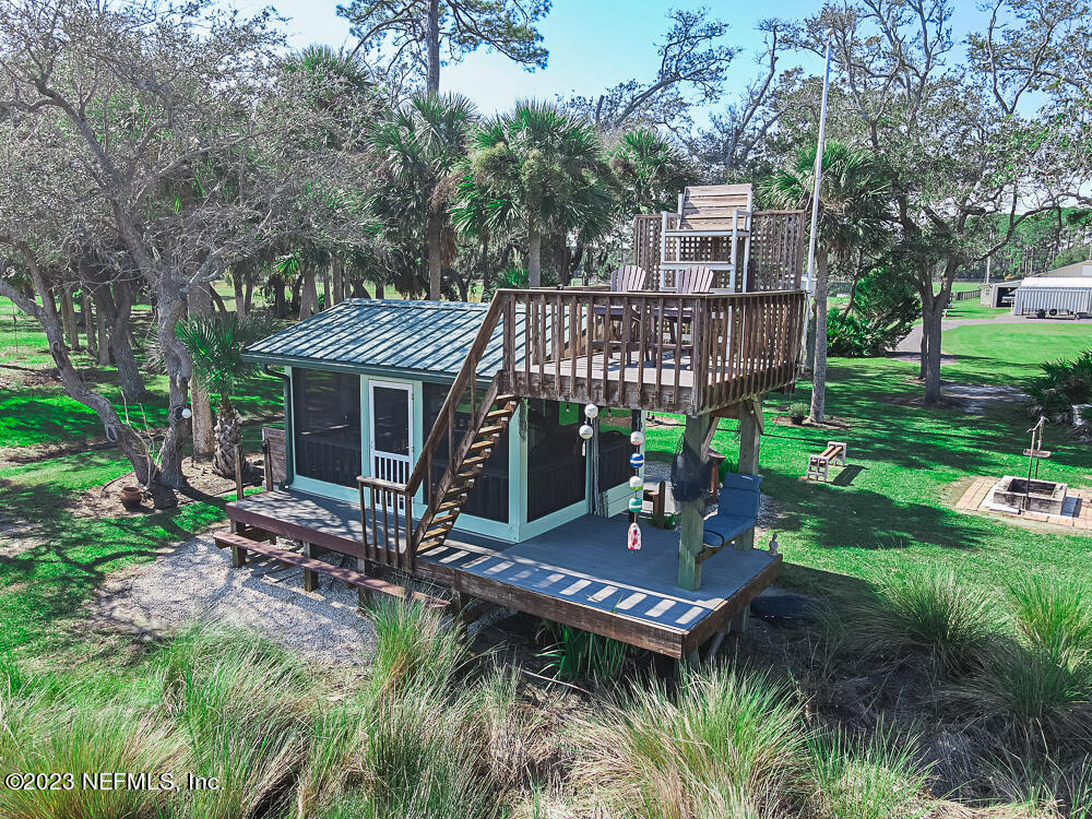 12625 Sawpit Road Jacksonville, FL 32226 - Photo 26 of 63 a view of a house with backyard and sitting area