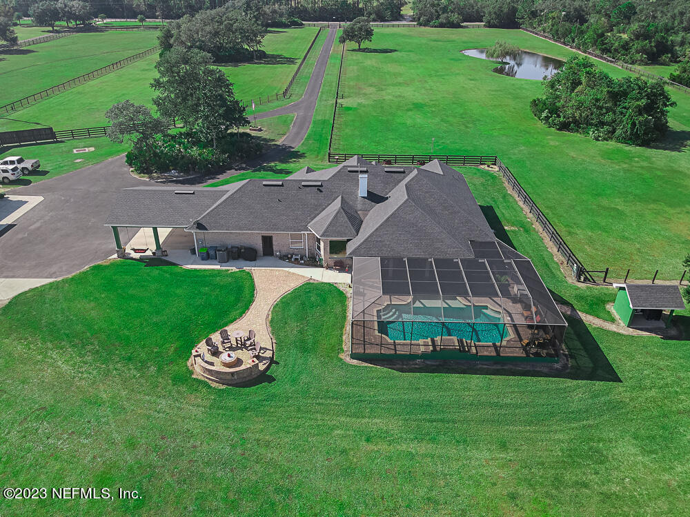 12625 Sawpit Road Jacksonville, FL 32226 - Photo 3 of 63 a view of a house with a big yard and large trees
