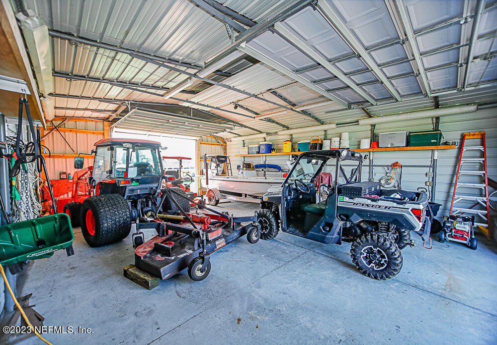 12625 Sawpit Road Jacksonville, FL 32226 - Photo 35 of 63 a view of a storage room with a lot of stuff